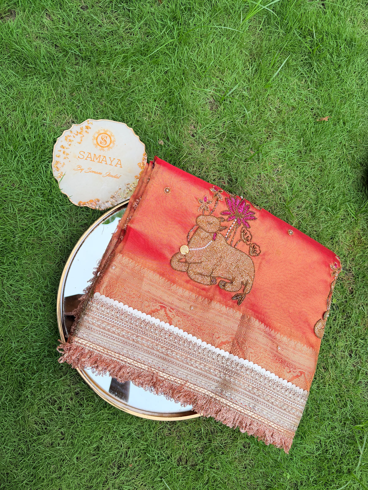 Peach Coral Organza Saree with Intricate Cow Motif & Cutwork Border Embroidery