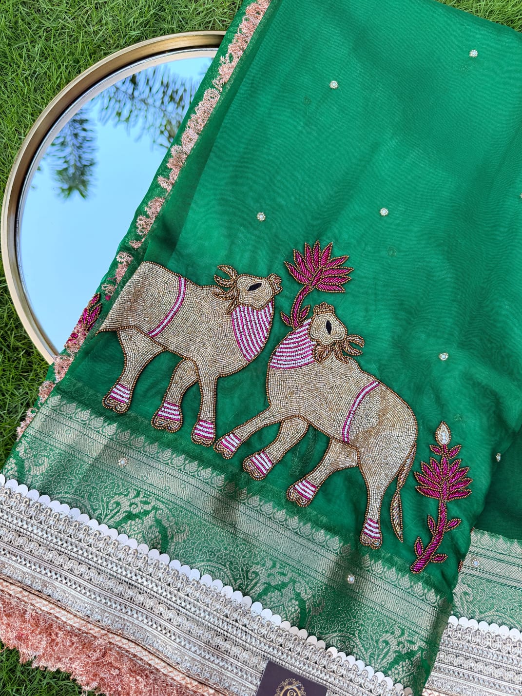 Emerald Green Organza Saree with Intricate Camel Motif & Cutwork Lace Border Embroidery