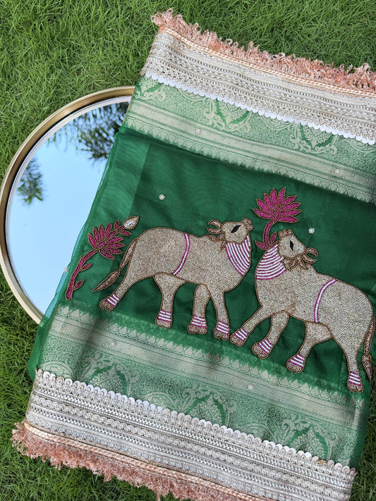 Emerald Green Organza Saree with Intricate Camel Motif & Cutwork Lace Border Embroidery